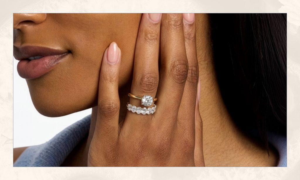 Woman wearing a diamond ring stack.