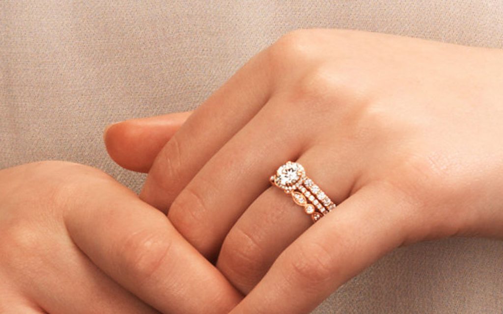 Three rings with the engagement ring in the center