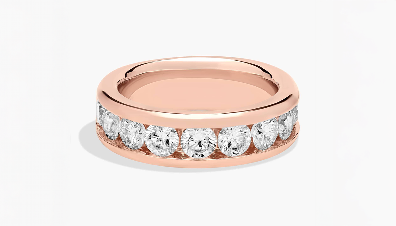 Channel set diamond ring in 14K rose gold with a smooth silhouette and refined h color diamond sparkle
