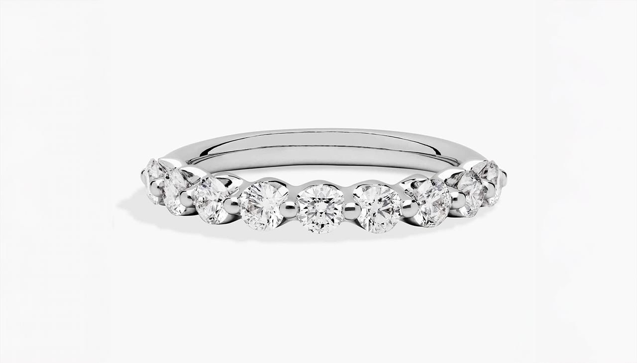 Floating diamond wedding ring in 14K white gold with a sleek profile and evenly spaced H color diamond accents