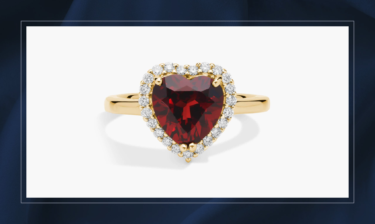 Garnet and diamond heart-shaped ring in yellow gold. 