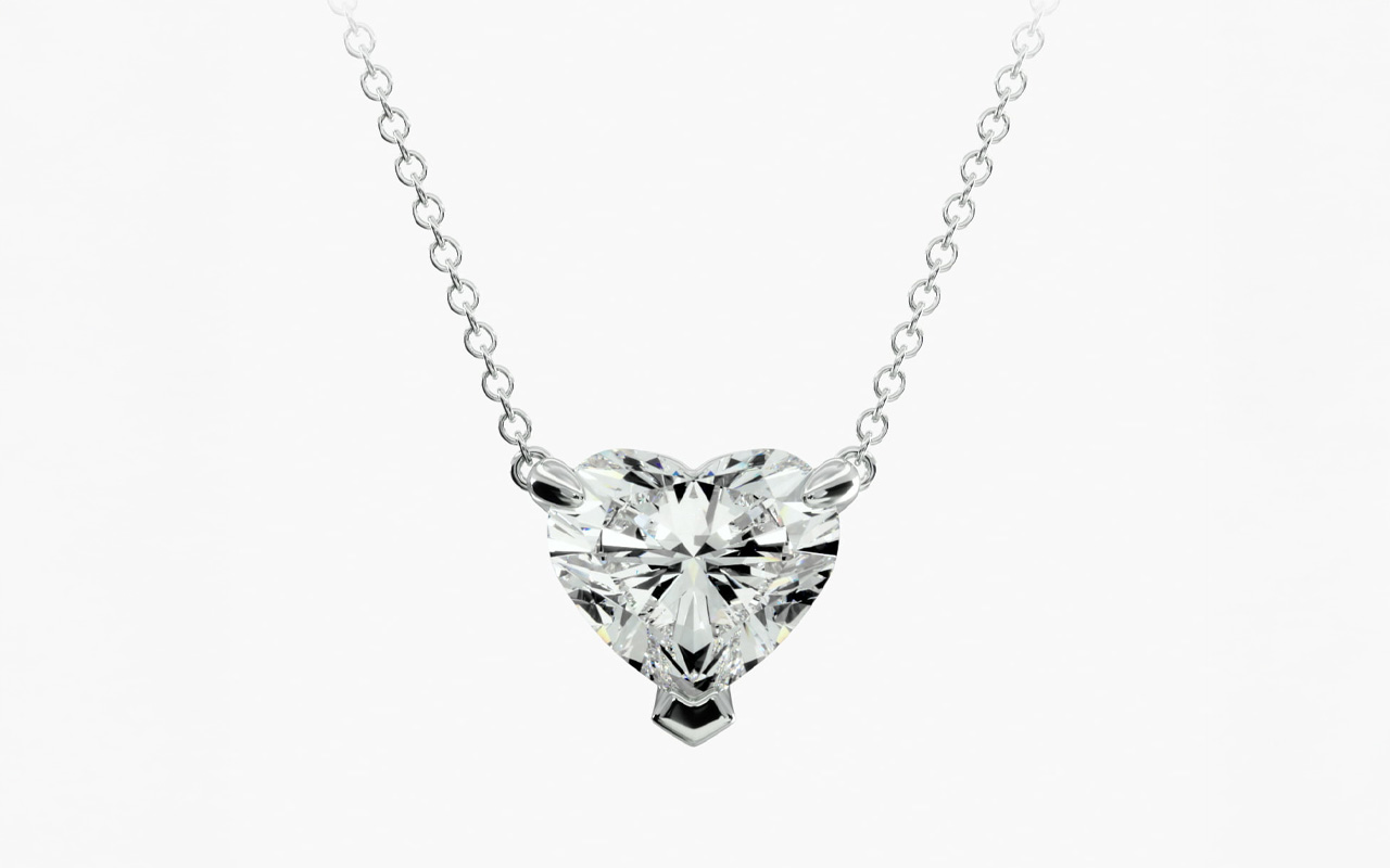 Heart cut diamond pendant in platinum showcasing a brilliant I colored diamond on a delicate chain