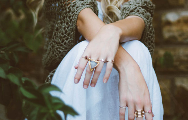 A women wearing boho style clothing and jewelry