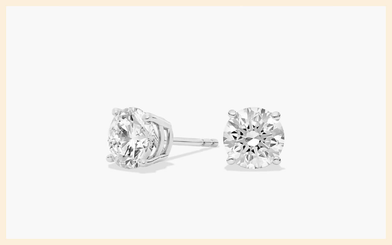 Four-prong round brilliant diamond stud earrings