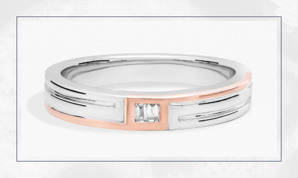 Ring featuring a white diamond set on a warm gold band, blending tones in a way that fits well within current engagement ring trends