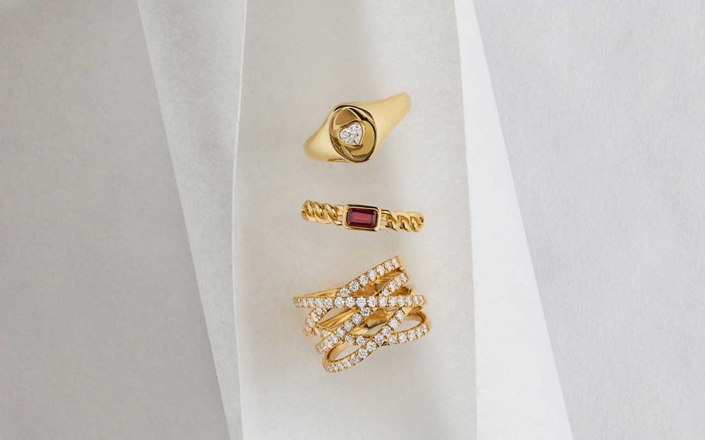 Stacked gold rings with diamonds and gemstones from the Blue Nile Modern Vintage Romance Collection