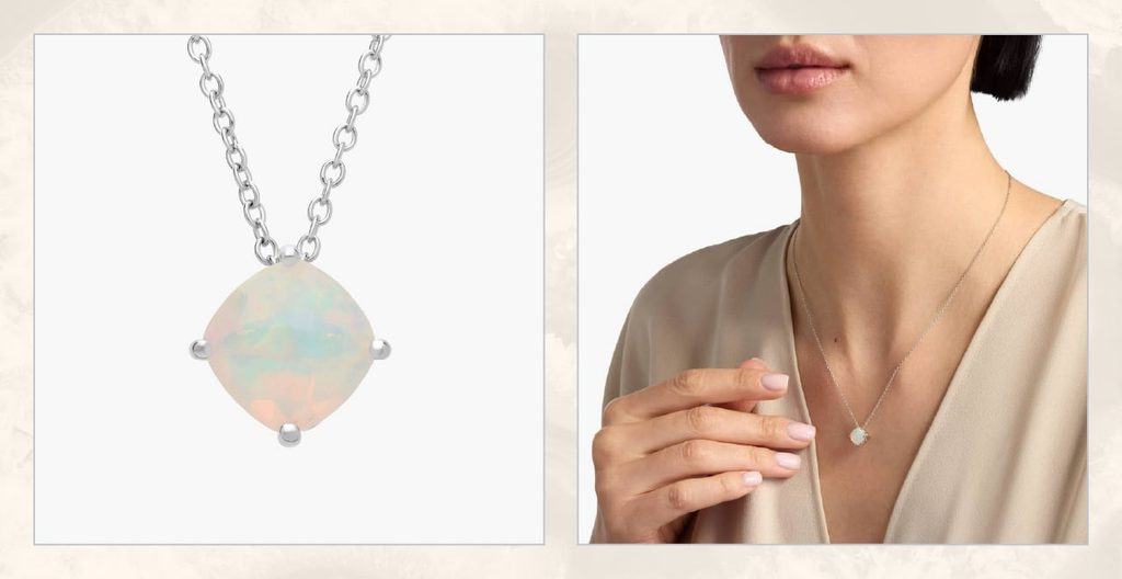 Woman wears silver and opal pendant necklace.