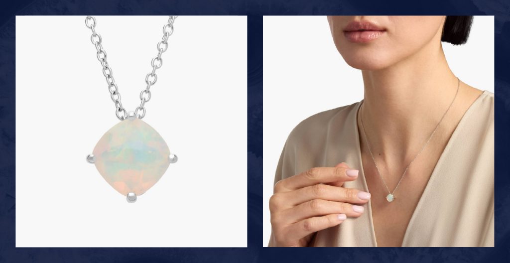 Woman wears silver and opal pendant necklace.