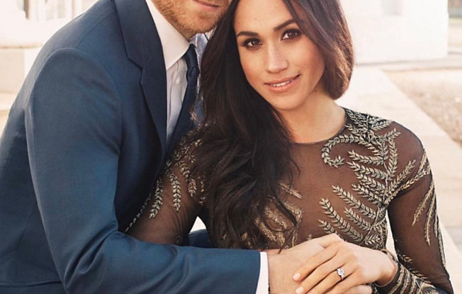 Megan Merkle sitting with her husband Prince Harry