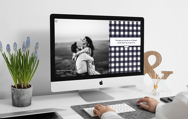 A man using a desktop computer to look at a wedding website