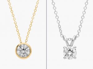 A silver and gold necklace hanging side-by-side.