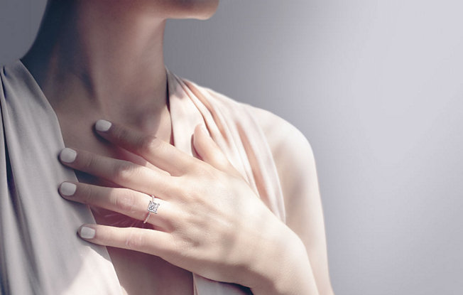 Close up of woman wearing a diamond ring