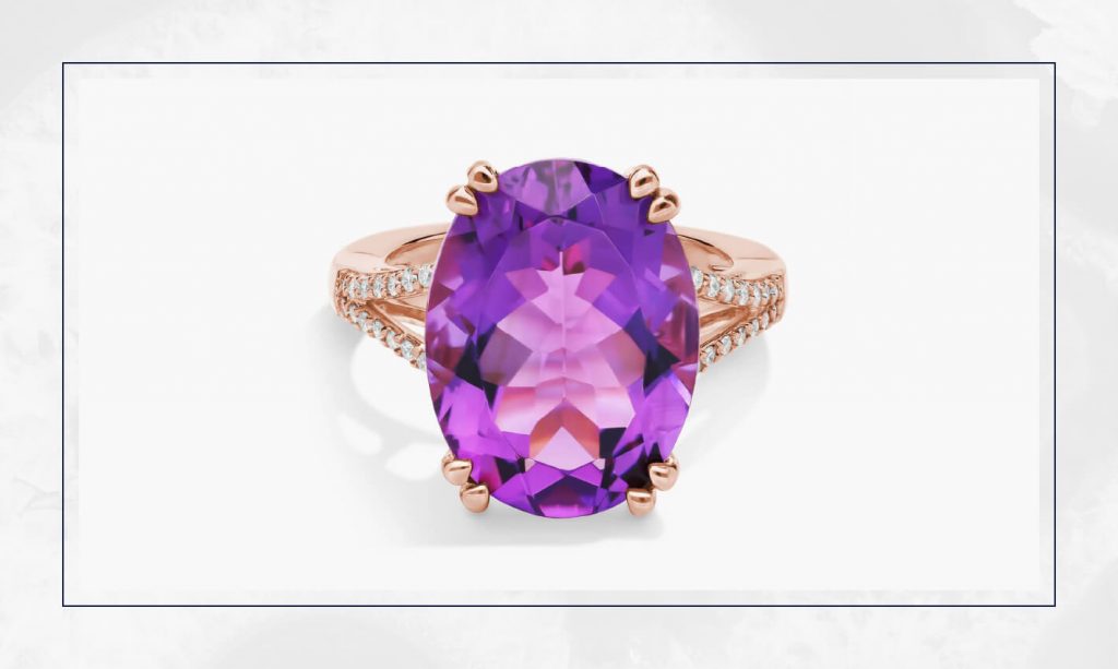 Oval purple amethyst set in rose gold with a split diamond band, offering a bold pop of color that fits today’s engagement ring trends