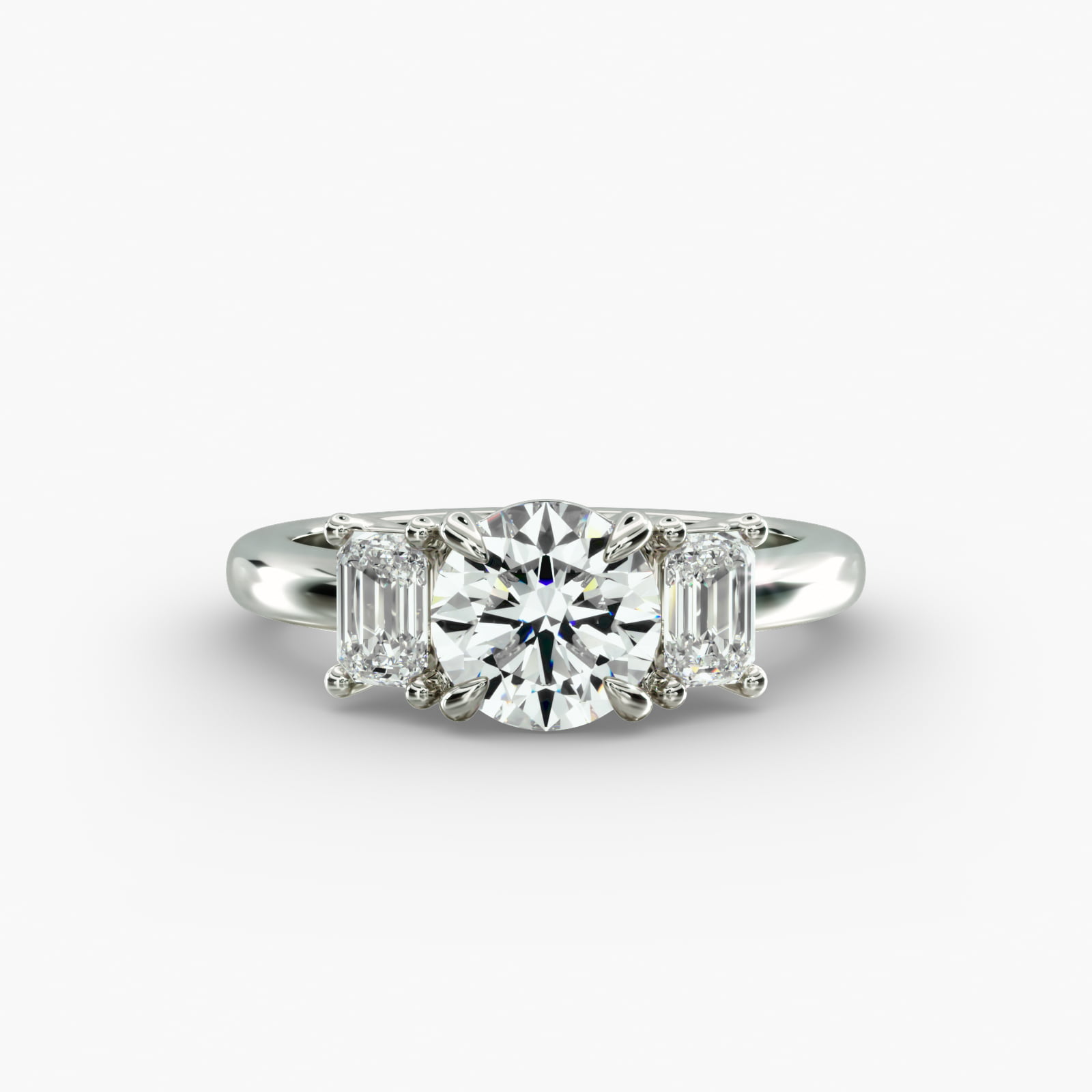 Side view of a three-stone emerald cut diamond engagement ring in platinum