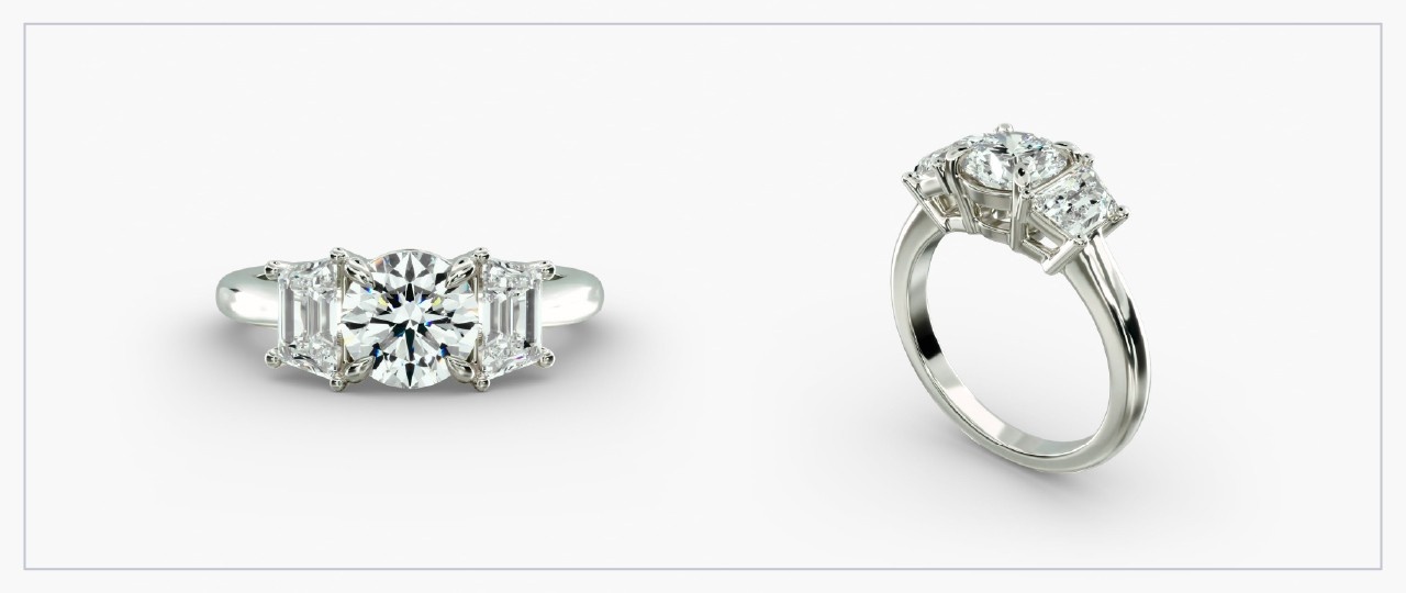 Front and side views of a white gold diamond three-stone ring