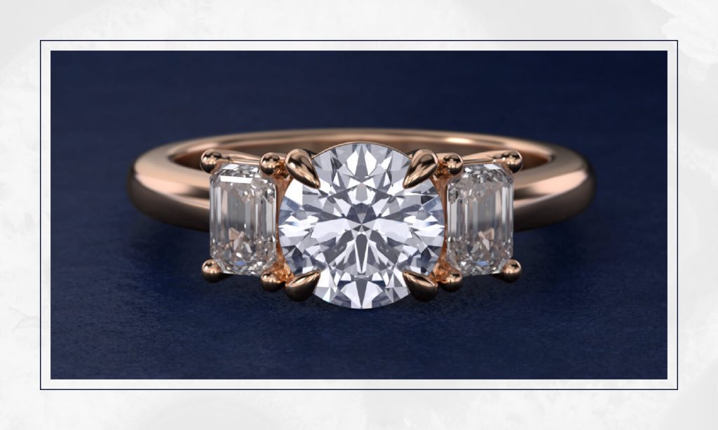 Three-stone ring with a round center diamond and emerald-cut sides in rose gold, a classic style that stays strong in trendy engagement rings