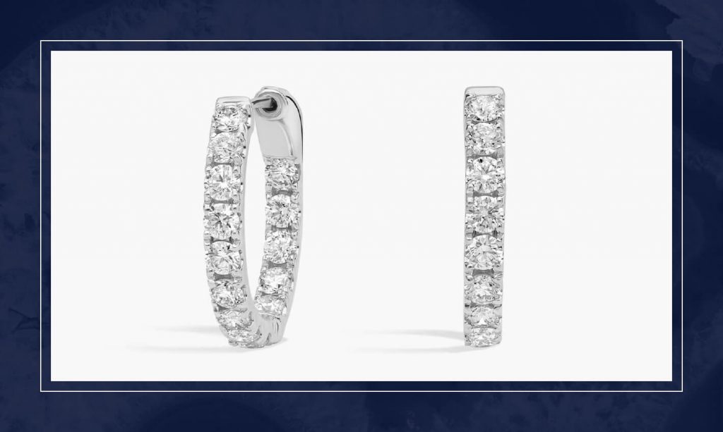 Pair of white gold diamond hoop earrings set with round diamonds along the front, creating classic sparkle with a streamlined profile.