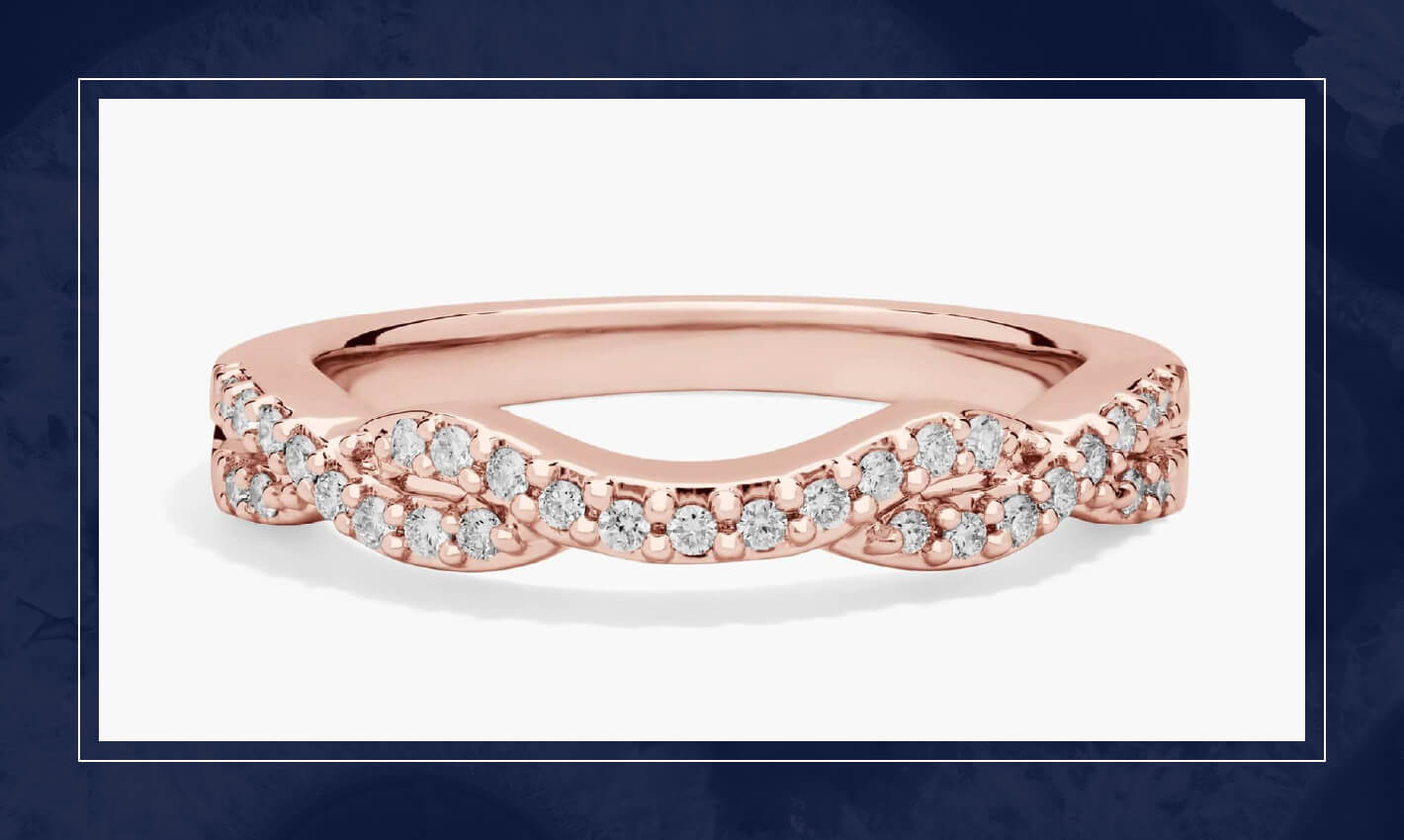 Rose gold infinity style diamond ring with pavé set round diamonds, featuring a graceful curve and low profile for stacking.