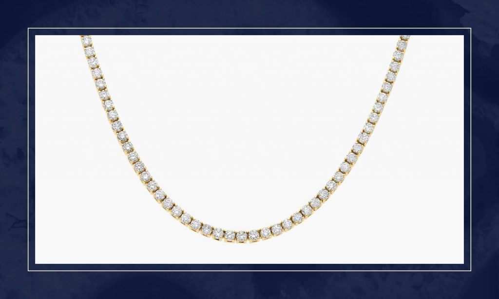 Yellow gold diamond tennis necklace with continuous round diamonds, designed to drape smoothly along the neckline with uniform sparkle.
