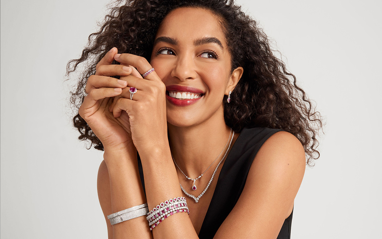 Woman wears a ruby ring as a wedding ring alternative.