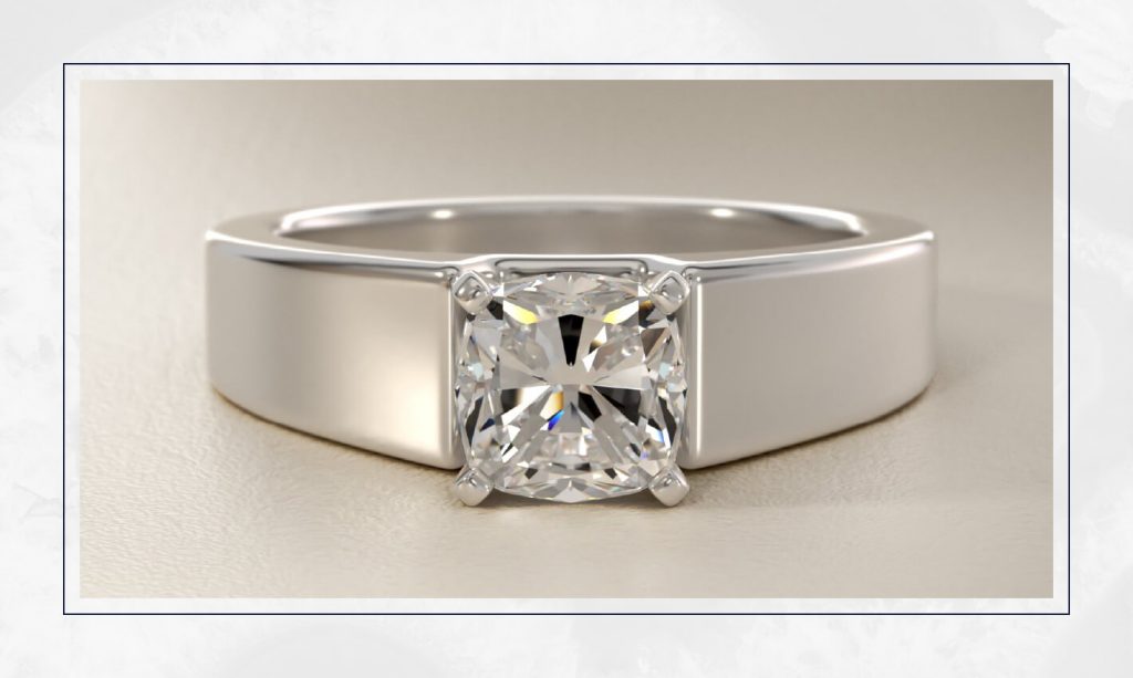 Bold solitaire set in a thick white gold band, giving a clean, sculptural look seen across many trendy engagement rings