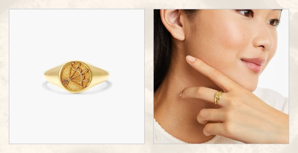 Woman wears gold zodiac ring.
